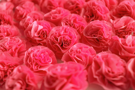 Red roses background, handmade from crepe paperの写真素材