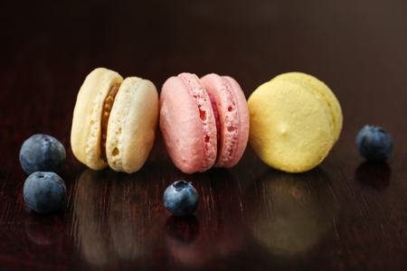 Three macarons on dark backgroundの写真素材