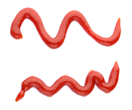 Two red ketchup curves splashes isolated on white, view from topの写真素材