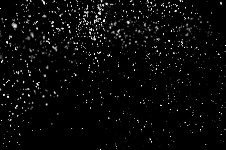 Flying snow isolated on whiteの写真素材