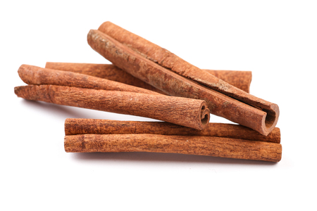 Cinnamon sticks isolated on whiteの写真素材