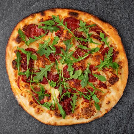 Salami pizza on the table, top viewの写真素材