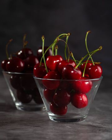 Two bowls of sweet cherryの写真素材