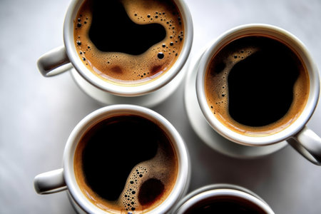 Coffee cups on a table, close-up, top viewの素材