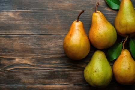 Ripe pears on wooden table. Top view with copy spaceの素材