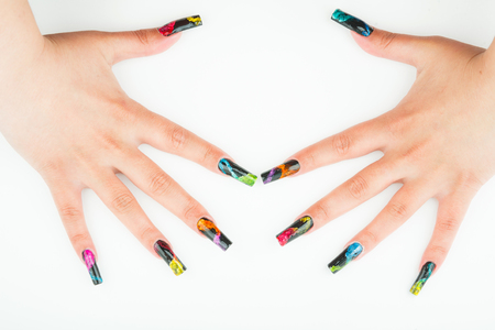 Woman hand closeup with beautiful manicure on white backgroundの写真素材