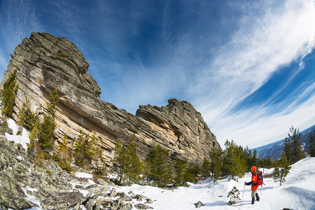 Winter Hiking in the mountains with a backpack and snowshoesの写真素材