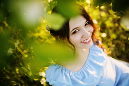 Girl in a flowering gardenの写真素材