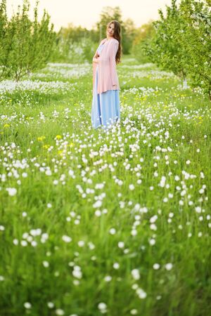 Girl in a flowering gardenの写真素材