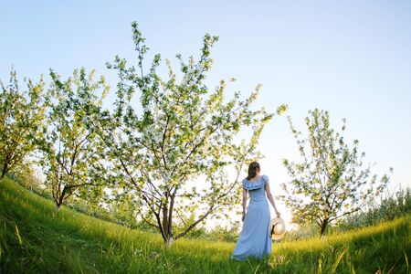 Girl in a flowering gardenの写真素材