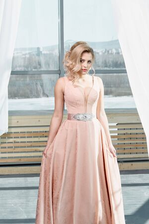 Fashion bride in gorgeous wedding dress. Beautiful model with bridal makeup and hairstyle in marriage dress.の写真素材
