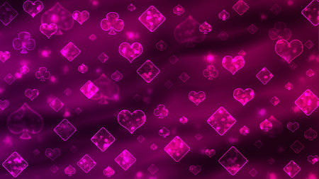 Bokeh pink pattern of playing cards symbols.