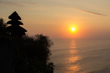 Sunset At Pura Uluwatu, Bali island, Indonesiaの写真素材