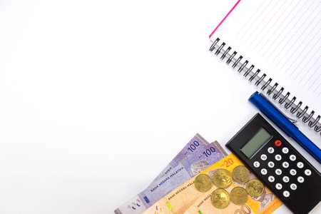 Malaysia Money with Calculator Pen and Notebook Isolated On White Backgroundの写真素材