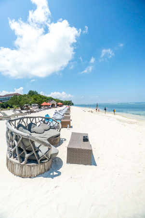 Tropical sandy beach with buildings and boats in a sea. Gili Trawangan, Indonesiaの写真素材