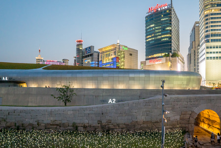 Seoul, Korea - May, 2016: LED lit roses and Dongdaemun Design Plaza, designed by the famous architect Zaha Hadid in Seoul, South Korea.のeditorial素材
