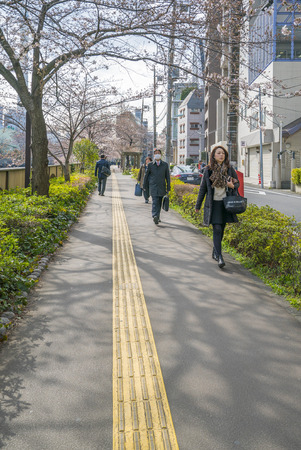Tokyo, Japan - April 3, 2017: Many people enjoy viewing cherry blossoms (sakura hanami) at Meguro River. Meguro River is the most famous place to enjoy cherry blossoms which is a Japanese custom.のeditorial素材