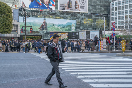 Tokyo, Japan - April 3, 2017: Pedestrians cross at Shibuya Crossing. It is one of the world's most famous and claim to be a busiest scramble crosswalks.のeditorial素材