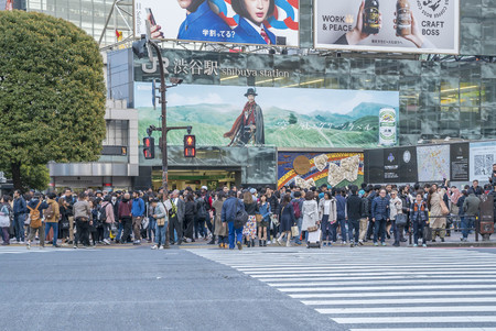 Tokyo, Japan - April 3, 2017: Pedestrians cross at Shibuya Crossing. It is one of the world's most famous and claim to be a busiest scramble crosswalks.のeditorial素材
