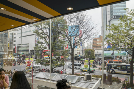 Tokyo, Japan - April 3, 2017: Pedestrians cross at Shibuya Crossing. It is one of the world's most famous and claim to be a busiest scramble crosswalks.のeditorial素材