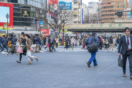 Tokyo, Japan - April 3, 2017: Pedestrians cross at Shibuya Crossing. It is one of the world's most famous and claim to be a busiest scramble crosswalks.のeditorial素材