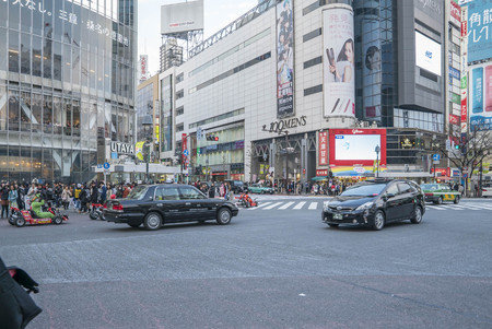 Tokyo, Japan - April 3, 2017: Pedestrians cross at Shibuya Crossing. It is one of the world's most famous and claim to be a busiest scramble crosswalks.のeditorial素材