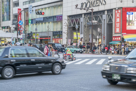 Tokyo, Japan - April 3, 2017: Pedestrians cross at Shibuya Crossing. It is one of the world's most famous and claim to be a busiest scramble crosswalks.のeditorial素材