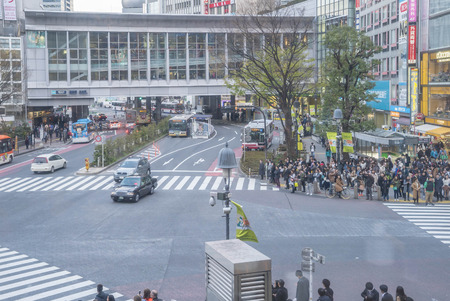 Tokyo, Japan - April 3, 2017: Pedestrians cross at Shibuya Crossing. It is one of the world's most famous and claim to be a busiest scramble crosswalks.のeditorial素材