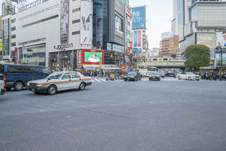 Tokyo, Japan - April 3, 2017: Pedestrians cross at Shibuya Crossing. It is one of the world's most famous and claim to be a busiest scramble crosswalks.のeditorial素材