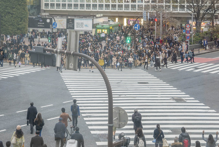 Tokyo, Japan - April 3, 2017: Pedestrians cross at Shibuya Crossing. It is one of the world's most famous and claim to be a busiest scramble crosswalks.のeditorial素材