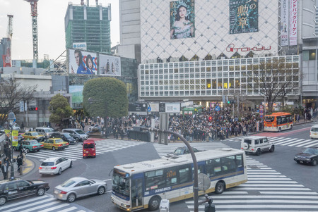 Tokyo, Japan - April 3, 2017: Pedestrians cross at Shibuya Crossing. It is one of the world's most famous and claim to be a busiest scramble crosswalks.のeditorial素材
