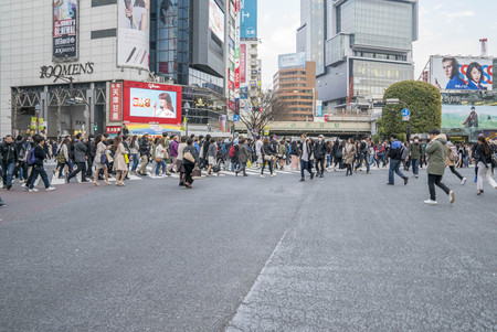 Tokyo, Japan - April 3, 2017: Pedestrians cross at Shibuya Crossing. It is one of the world's most famous and claim to be a busiest scramble crosswalks.のeditorial素材