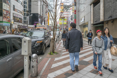 Tokyo, Japan - April 3, 2017: Pedestrians cross at Shibuya Crossing. It is one of the world's most famous and claim to be a busiest scramble crosswalks.のeditorial素材