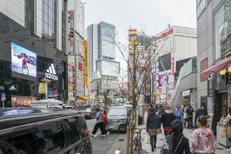 Tokyo, Japan - April 3, 2017: Pedestrians cross at Shibuya Crossing. It is one of the world's most famous and claim to be a busiest scramble crosswalks.のeditorial素材