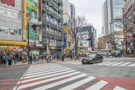 Tokyo, Japan - April 3, 2017: Pedestrians cross at Shibuya Crossing. It is one of the world's most famous and claim to be a busiest scramble crosswalks.のeditorial素材