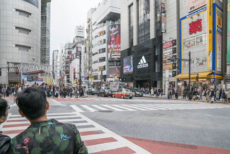 Tokyo, Japan - April 3, 2017: Pedestrians cross at Shibuya Crossing. It is one of the world's most famous and claim to be a busiest scramble crosswalks.のeditorial素材