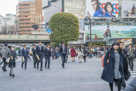 Tokyo, Japan - April 3, 2017: Pedestrians cross at Shibuya Crossing. It is one of the world's most famous and claim to be a busiest scramble crosswalks.のeditorial素材