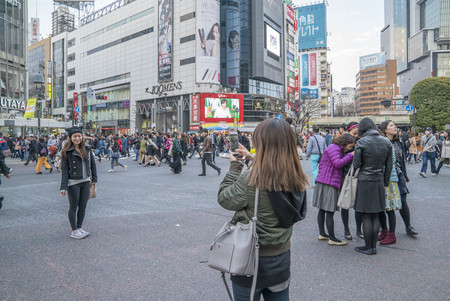 Tokyo, Japan - April 3, 2017: Pedestrians cross at Shibuya Crossing. It is one of the world's most famous and claim to be a busiest scramble crosswalks.のeditorial素材