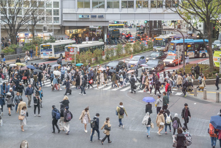 Tokyo, Japan - April 3, 2017: Pedestrians cross at Shibuya Crossing. It is one of the world's most famous and claim to be a busiest scramble crosswalks.のeditorial素材