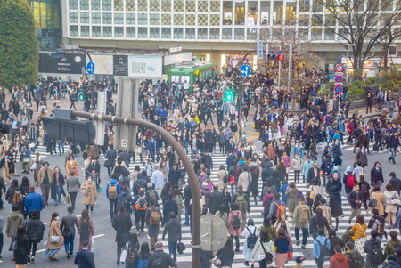 Tokyo, Japan - April 3, 2017: Pedestrians cross at Shibuya Crossing. It is one of the world's most famous and claim to be a busiest scramble crosswalks.のeditorial素材