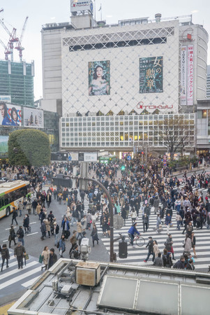 Tokyo, Japan - April 3, 2017: Pedestrians cross at Shibuya Crossing. It is one of the world's most famous and claim to be a busiest scramble crosswalks.のeditorial素材