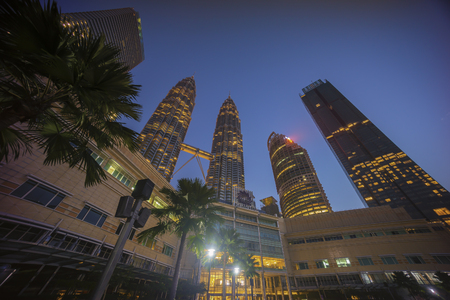 Kuala Lumpur, Malaysia - July 7, 2018: Sunrise at Kuala Lumpur city skyline with Petronas KLCC Twin Towers and surrounding buildingのeditorial素材