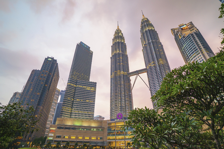 Kuala Lumpur, Malaysia - July 7, 2018: Sunset at Kuala Lumpur city skyline with Petronas KLCC Twin Towers and surrounding buildingのeditorial素材