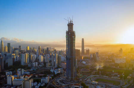Kuala Lumpur, Malaysia - January 5, 2020: Aerial dronw view of sunrise at Kuala Lumpur city skyline.