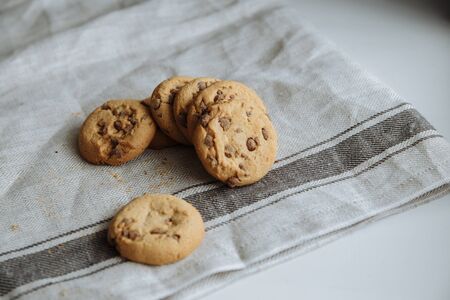brown cookies on the light gray textile background