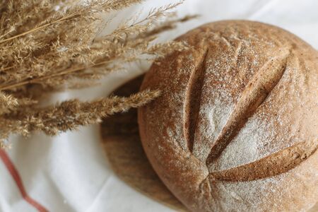 Sliced bread on a board on a white tablecloth