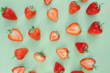 A lot of juicy, red strawberries, on a wooden table.の写真素材