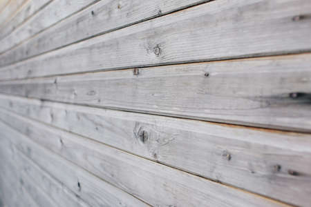 Old, grey, shabby, wooden wall.の写真素材
