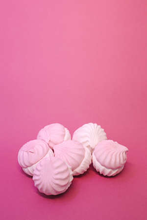 Lots of sweet, beautiful macarons on a colored background in full screen.の写真素材