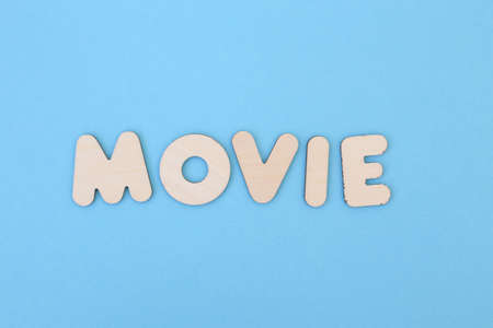 A lot of wooden letters on a colored background full screen.